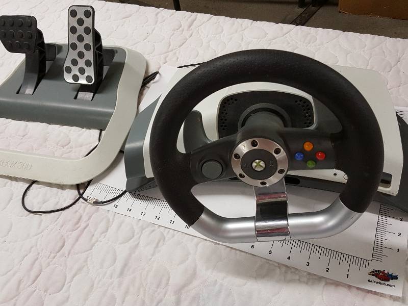 lot 1136 image: In nice condition is this XBox 360 Steering wheel, dash board and go fast pedal assembly