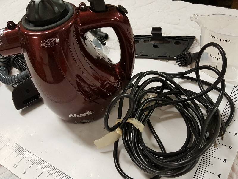 lot 1140 image: Shark Steam cleaner that looks pretty good and like new but in looking close it has been used