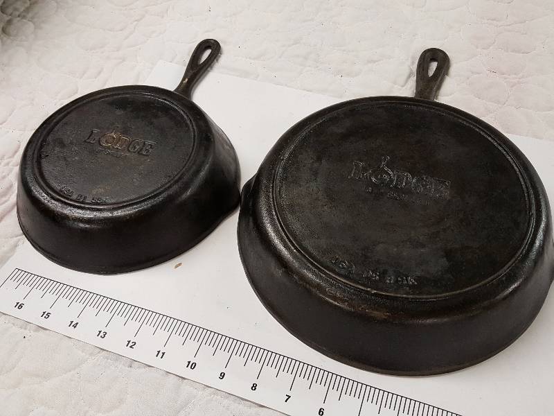 lot 1144 image: Serious pair of Lodge heavy cast iron skillets 8 and 10 already seasoned and ready for the bacon