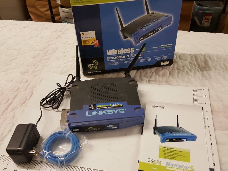 lot 1146 image: Used wireless Linksys G broadband office or home WiFi router and install hardware