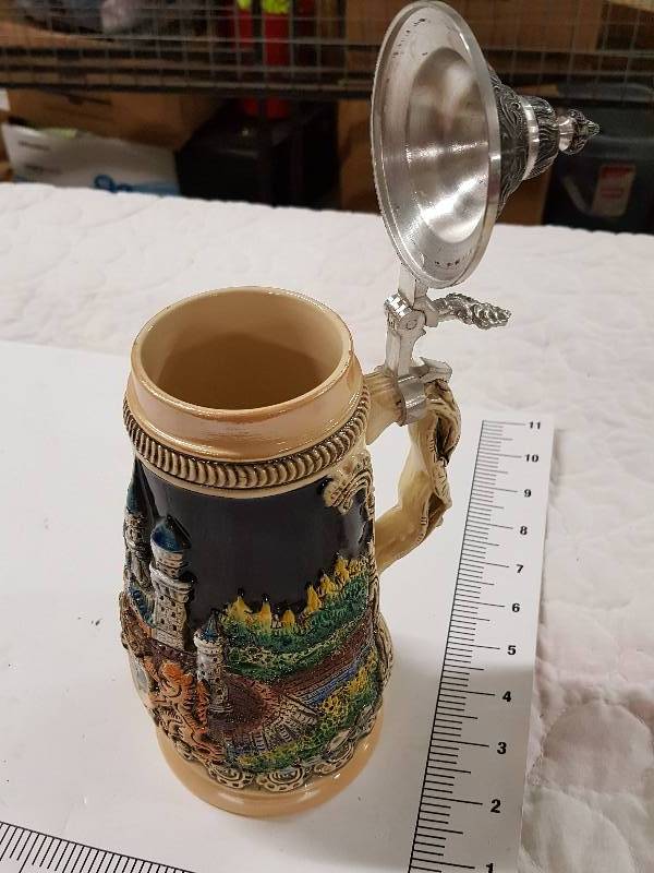 lot 1148 image: Coll looking Neuschwanstein beer stein with lid on the top.  Lots of great colors and graphics