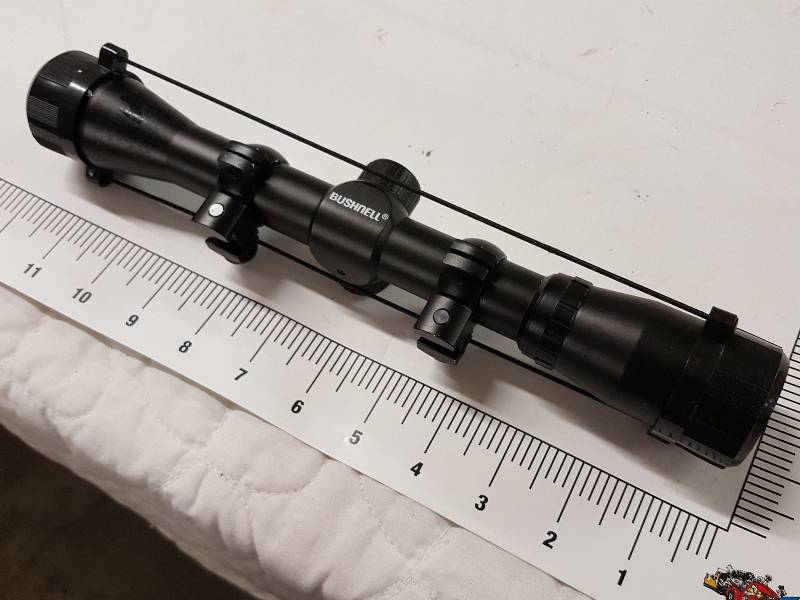 lot 1157 image: New Bushnell rifle scope site with lens protective covers and adjustable mounting brackets not sure of power