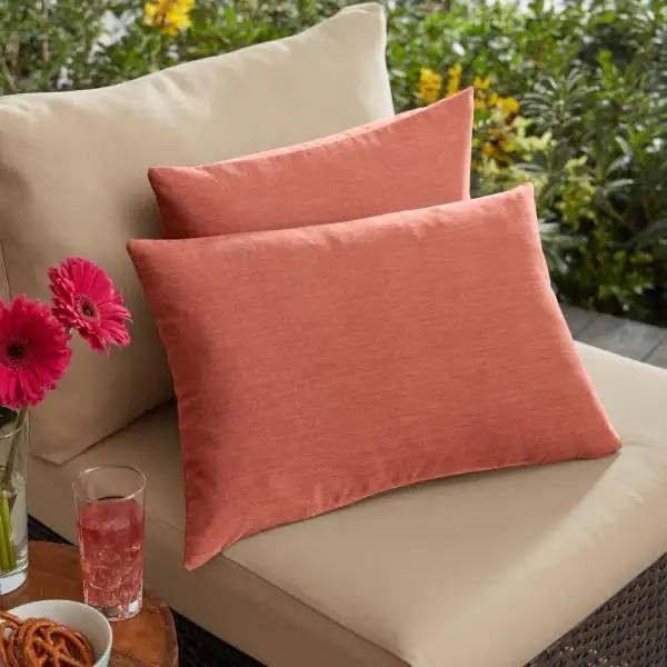 lot 24611 image: Sorra Home - Sunbrella Coral Rectangular Outdoor Knife Edge Lumbar Pillows (2-Pack) - Retail $75.99