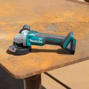 lot 23502 image: Makita - 18V LXT Lithium-Ion Brushless Cordless 4-12 in.5 in. Cut-OffAngle Grinder (Tool-Only) - Retail $149.00