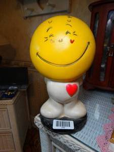 lot 1259 image: 10 Tall Happy Face Plastic Collectible Bank