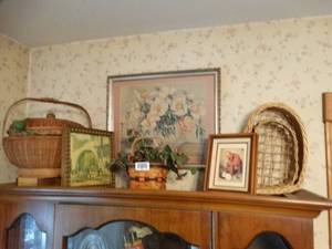 lot 1461 image: All  Contents on Top of China Cabinet  Vintage Wall Art  Faux Plants   Baskets