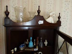 lot 1567 image: Contents on Top 2 Shelves on In Wood Corner Cabinet  Bells  Vases  Misc