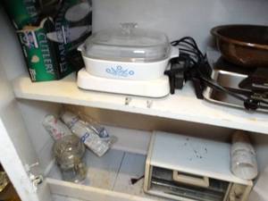 lot 1586 image: Contents of Bottom Cabinet  Toaster Oven - Waffle Maker - Corning Ware - Etc