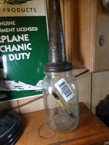 lot 1626 image: Jar w Old Metal Funnel  for Oil