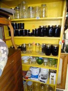 lot 1793 image: Contents on Yellow Shelves  Canning Jars  Slow Cooker  Coffee Pot  Etc