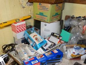 lot 1837 image: Contents on Corner of Table  Cups - Batteries - Vac Parts Voltage Meters - Vaporizer - Humidifier - Misc