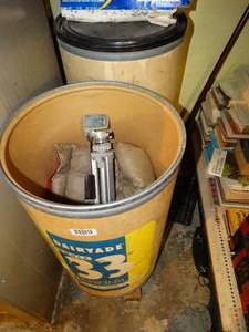 lot 1851 image: Two - 3 Ft Barrels w Contents  Camera Tripod and Misc
