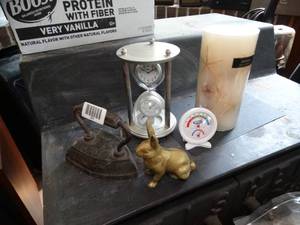 lot 1890 image: Decor on top of Fireplace  Iron  Rabit Metal Bank  Clock  Candle