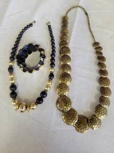 lot 1294 image: 2 necklaces and a bracelet wblack and gold tones