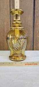 lot 1311 image: Gold tone decor on an amber vase