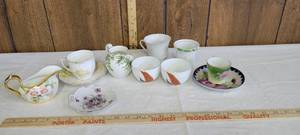 lot 1339 image: Teacups, plates and small pitchers- markings in pics