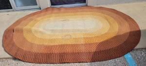 lot 1361 image: Vintage braided rug- extremely large- has stains and needs restitched in a couple places