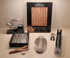 lot 222 image: Rabbit Wine Opener, Corkscrew Set, Cork Display Case (New), Foil Cutters, Corkcicle, 6pc Cheese Tool Set, Wood Tongs, Vintage WMF Germany Cromargan Toast Rack