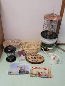 lot 279 image: Bird Feeders, Bird Food, Sign, Baskets Water Can and Flags