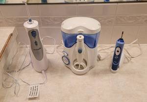 lot 316 image: (2) Water Piks and Oral B Toothbrush