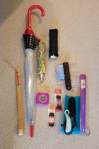 lot 323 image: Umbrellas, BeltTie Rack, Shoelaces, Clock, and More