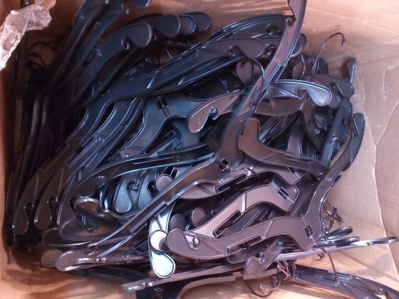 lot 29 image: Black Plastic Hangers