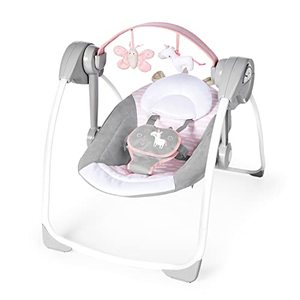 lot 28222 image: Ingenuity Comfort 2 Go Compact Portable 6-Speed Baby Swing with Music, Folds for Easy Travel - Flora the Unicorn (Pink), 0-9 Months   (Factory sealed)