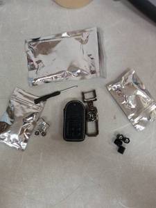 lot 7117 image: Honda key fob case and valve stem cover bundle