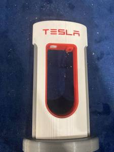 lot 75805 image: TESLA PHONE CORD HOLDER