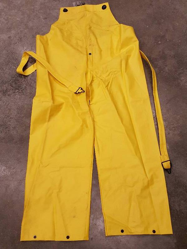 lot 8381 image: Slightly dirty but never used is this pair of size Medium Cyclone .35mm PVCNylonPVC Bibs.