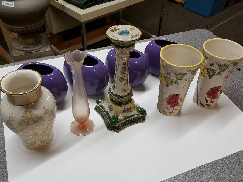 lot 8384 image: Wild assortment is this box of vases from a flower shop many years ago.