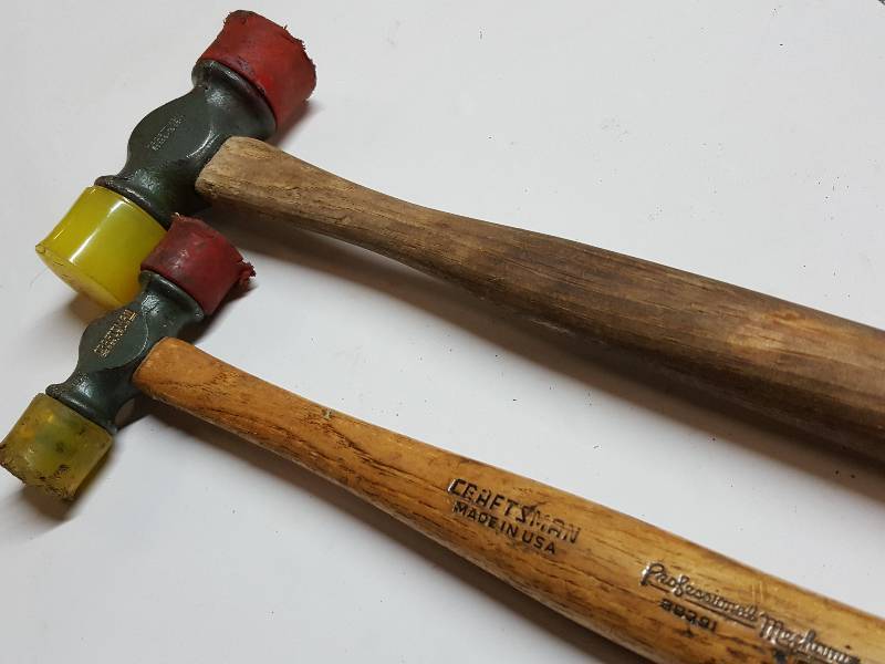 A pair of Craftsman rubber/ plastic hammer mallets made in the USA