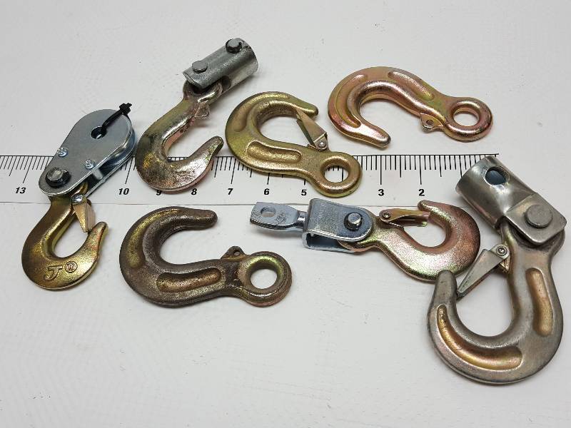 lot 8396 image: Heres a nice assortment of J-Hooks.  A couple have swivels, 1 has a cable pulley.  Out fit your cherry picker or winch