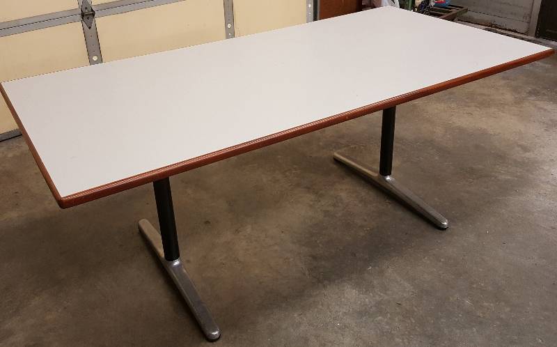 lot 8334 image: Very heavy duty and high quality office 3 X 6 (30 off the floor) table with wood trim on the sides.