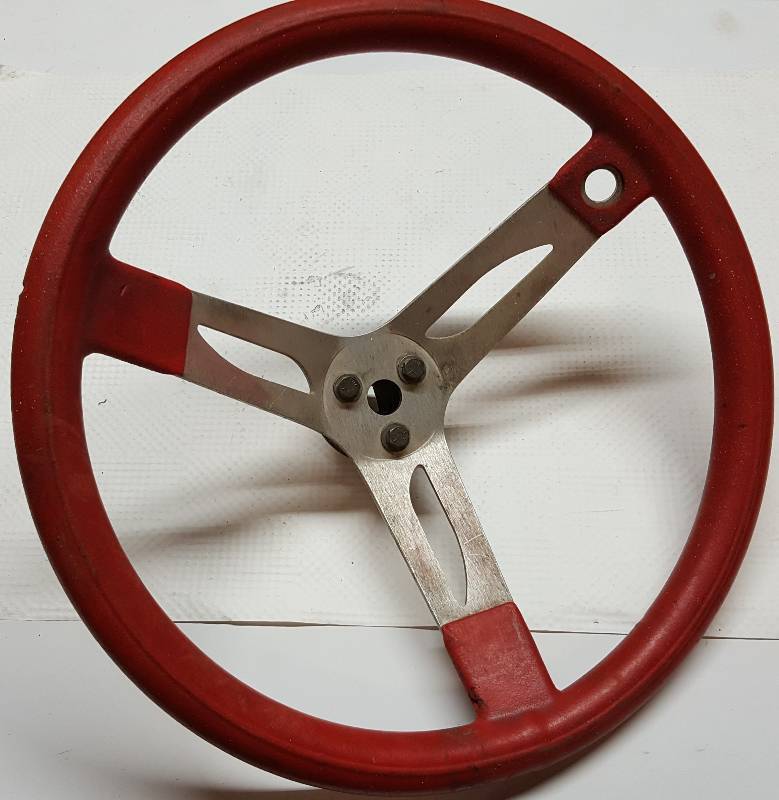 lot 8344 image: Right off the Oval track race car is this light weight aluminum steering wheel with Red wrap.