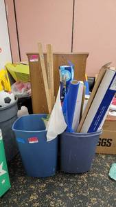 lot 9676 image: 2 Blue Trash Cans W Contents - 3ft Wooden Rulers, Plastic Table Covers, and More