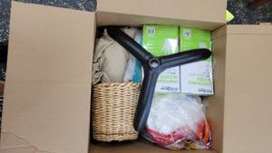 lot 9728 image: Box of Home Goods - One Size Disposable Gloves, Space Heater, and More