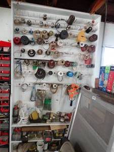 lot 1028 image: 7Ft Tall White Spool Shelves w Contents  Huge Lot 