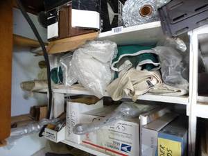 lot 1043 image: Contents of 3 Shelves  Insulation Casters  Birdie Net Paper Rolls and More