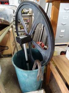 lot 1305 image: Measuring Wheel in Can w Pry-bar