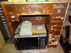 lot 1508 image: Tall Wood Old Printers Deck with Several Small Drawers  Adding Machine and Microwave