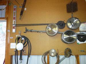 lot 1555 image: All Contents on Peg Board  Saw Blades  and More