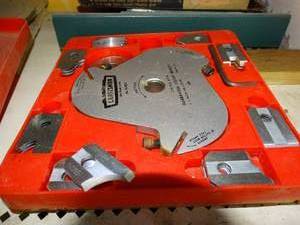 lot 1580 image: Craftsman Triple Cutter Molding Head, Groove Blade Cutter and misc items