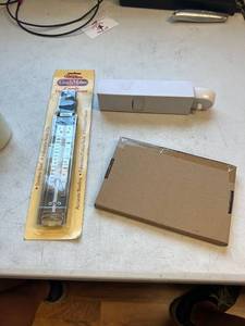 lot 879 image: 3 item lot. Braun 7040-132 Compact Charger, Candy thermometer, microwave filter,
