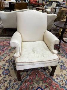 lot 1021 image: Upholstered captains chair with wood detail needs reupholstered