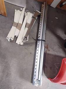 lot 1106 image: Wall shelving racks and rails