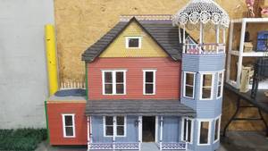 lot 2005 image: Large doll house 76 x 81 x 34 with box of plaints, trim and more)