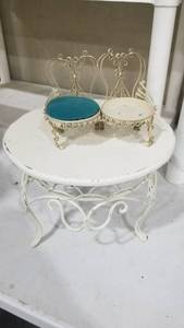 lot 2022 image: Wrought iron table 9 x 11and small loveseat missing cushion on one side
