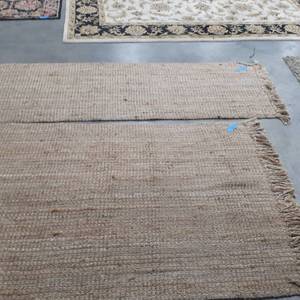 lot 1059 image: (2) Outdoor rugs. One is 101 x 31 and the other is 83 x 49