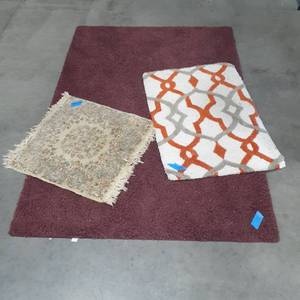 lot 1062 image: (3) More various rugs. Maroon rug 71 x 48, white, grey and orange 25 x 36 the other 24 x 25